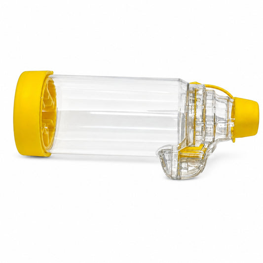Placebo inhaler spacer device for asthma inhaler training and respiratory care education with clear chamber and yellow cap.