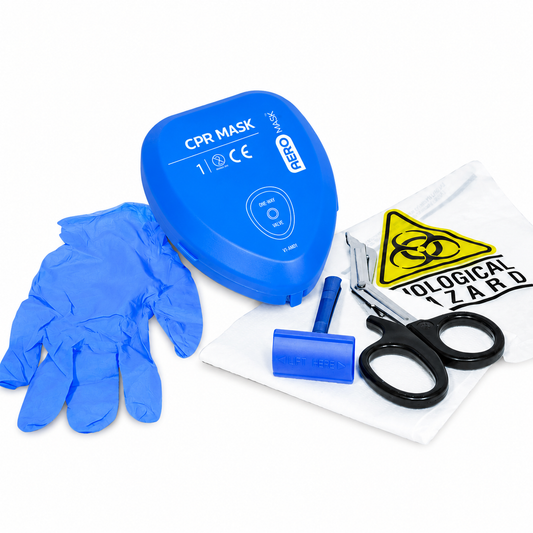 AED prep kit containing disposable gloves, trauma shears, razor, CPR mask, and biohazard disposal bag arranged on a white background.
