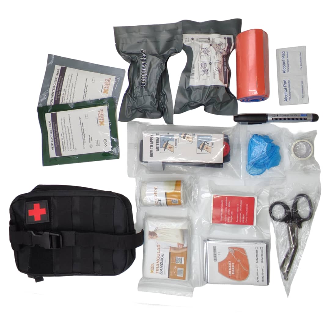 Compact first aid response kit with bandages, chest seals, gloves, trauma shears and tourniquet supplies displayed on a white background.
