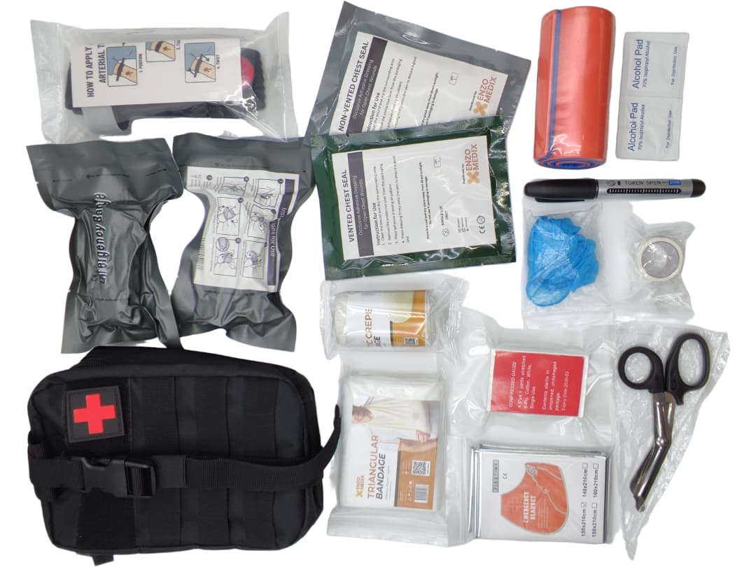 Portable first aid pouch kit with emergency response supplies, support bandages, chest seals and trauma accessories.